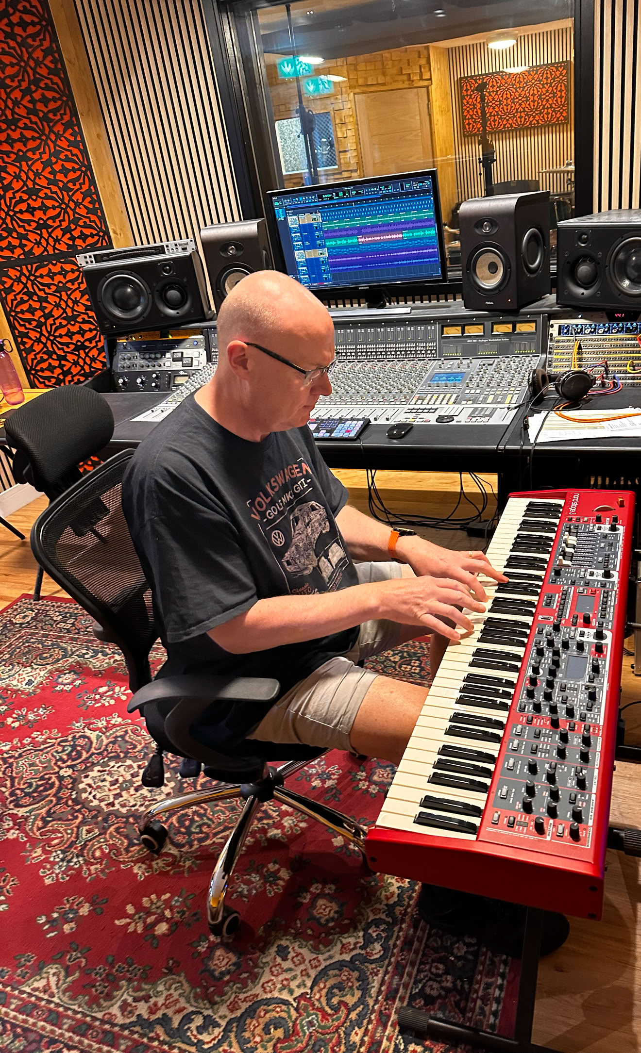Songwriter composing music on keyboard